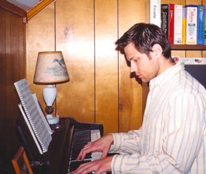Peter J Hopkins playing piano